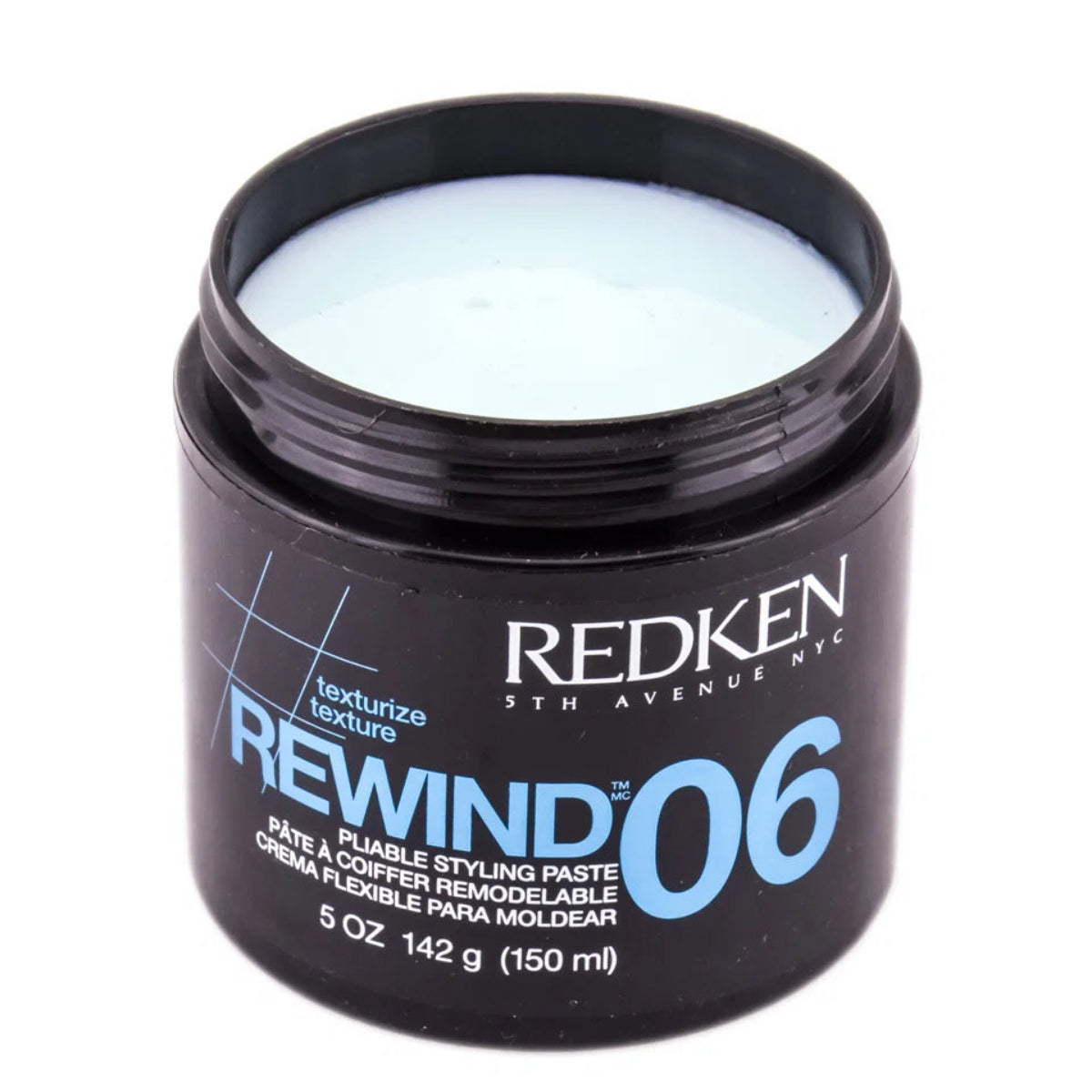A 5 oz black plastic jar of Redken Rewind 06 Texturize Texture Styling Paste, showing the pale blue cream product inside, on a white background.