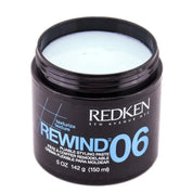 A 5 oz black plastic jar of Redken Rewind 06 Texturize Texture Styling Paste, showing the pale blue cream product inside, on a white background.