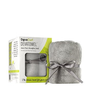 A gray microfiber hair towel with a ribbon tied around it, displayed in front of its packaging box which has 'DevaCurl DevaTowel' written on it.