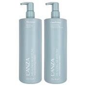 Two tall L'ANZA Healing Moisture shampoo and conditioner pump bottles in a pale icy blue color, shown side-by-side on a plain white background.