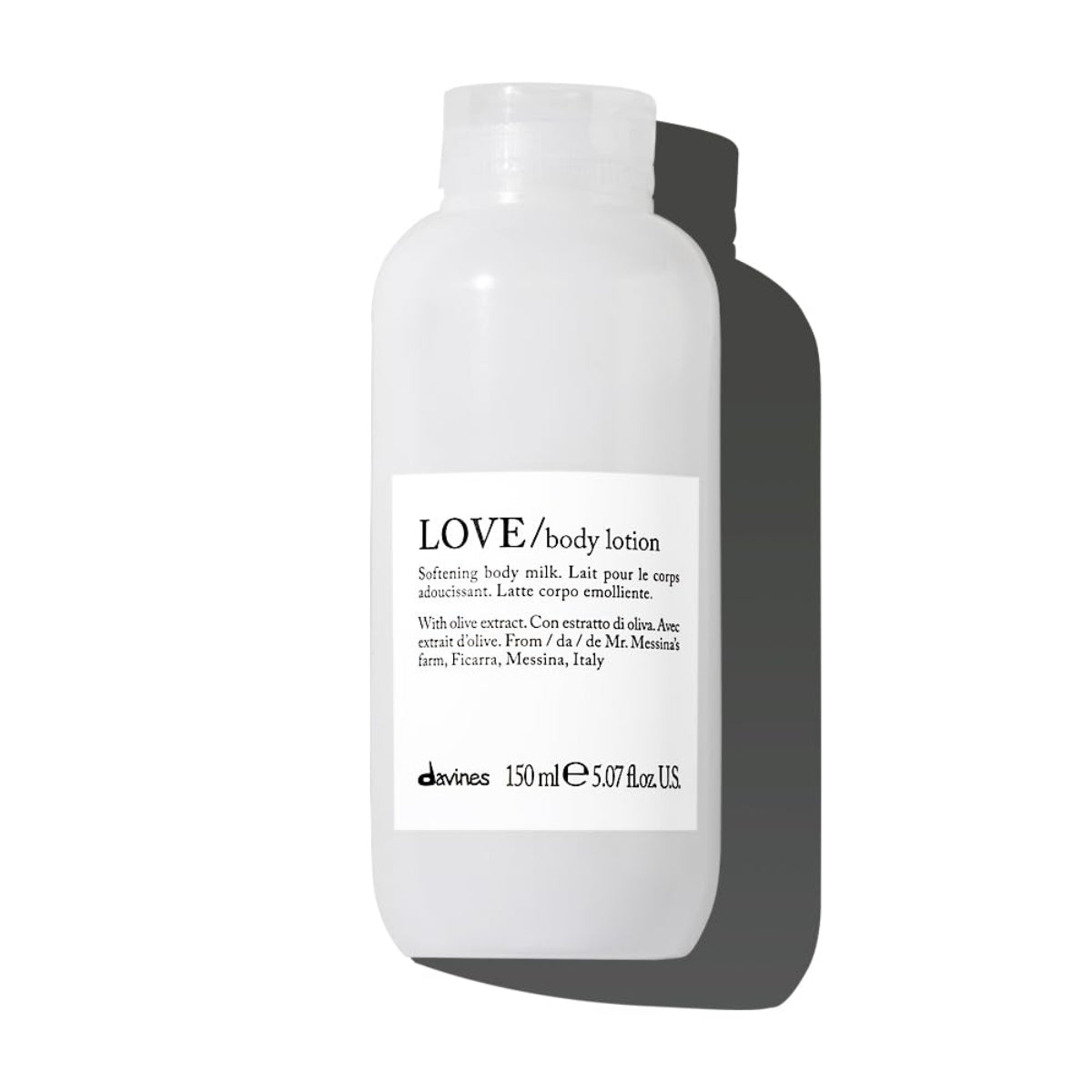 White bottle of Davines LOVE body lotion on a white background
