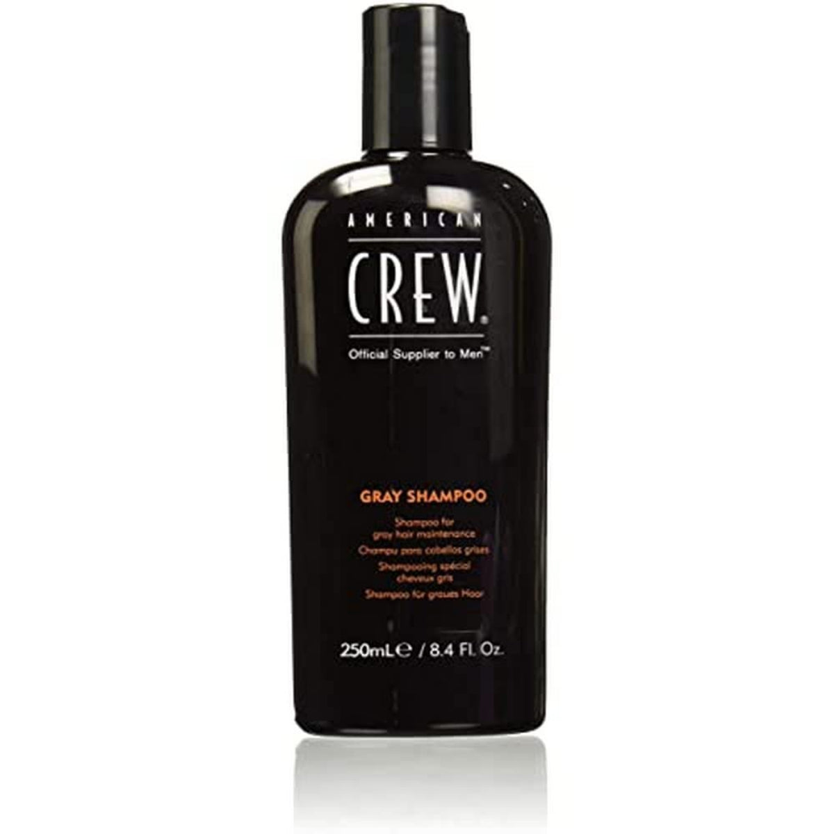 Black shampoo bottle with 'American Crew' branding on a white background