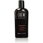 Black shampoo bottle with 'American Crew' branding on a white background