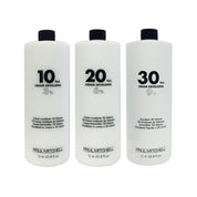 Three bottles of Paul Mitchell cream developers with different volumes on a white background