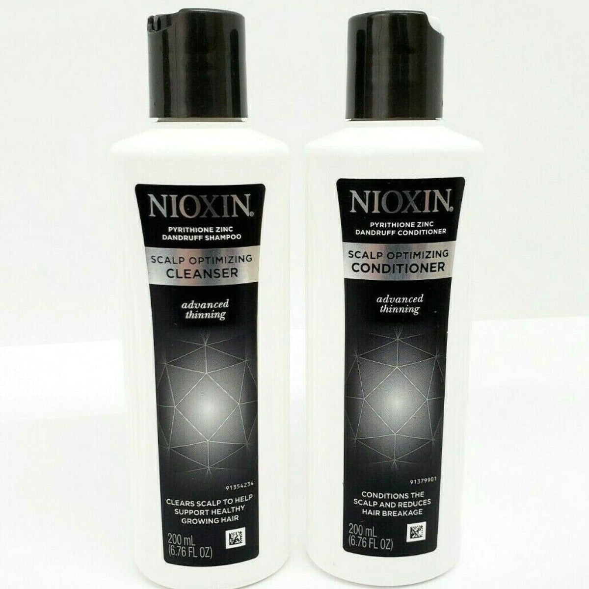 Two Nioxin scalp care products on a white background