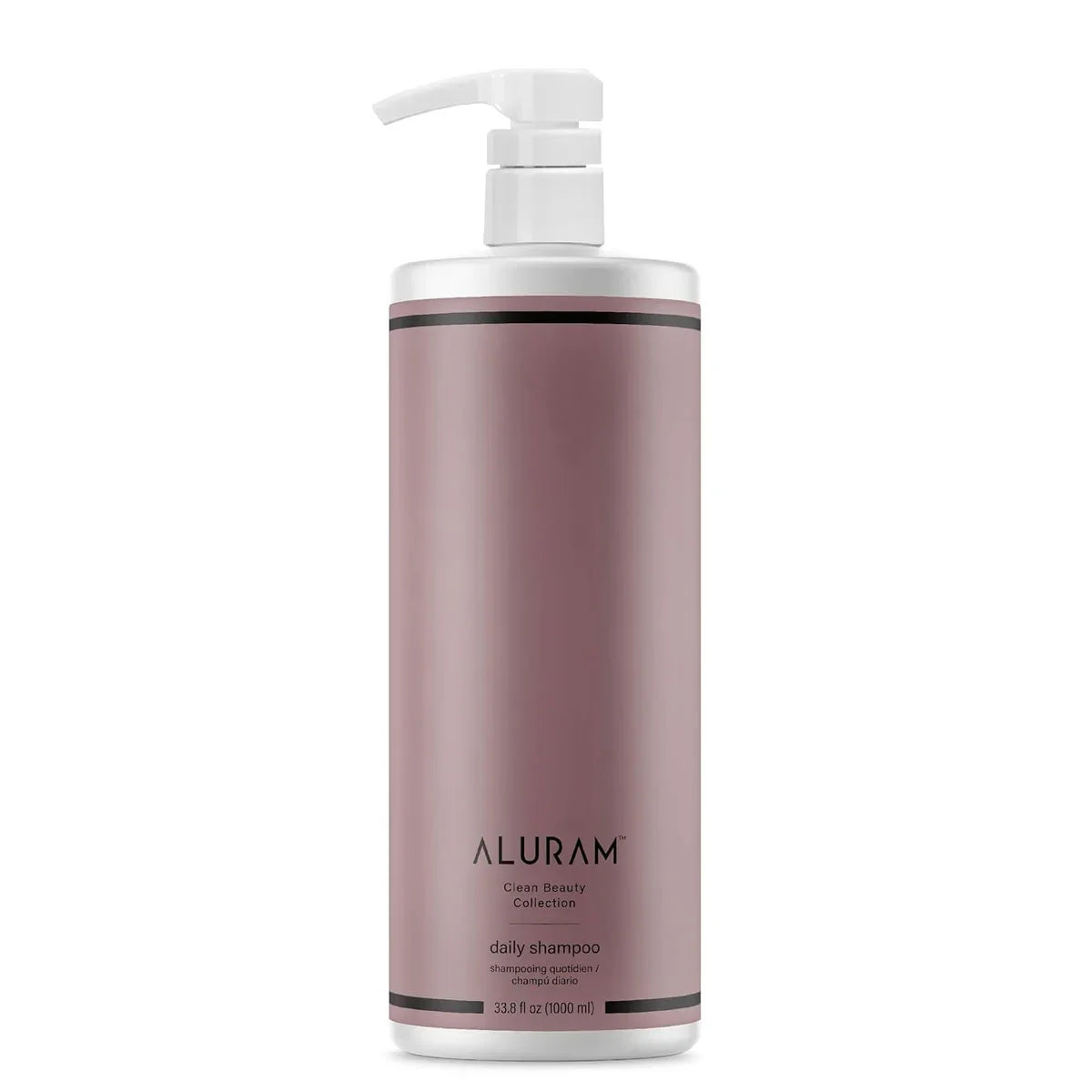 Shampoo bottle with pump labeled 'Aluram Clean Beauty Collection Daily Shampoo 33.8 oz' on a white background