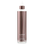 Aluram High Shine Glossing Treatment bottle on a white background