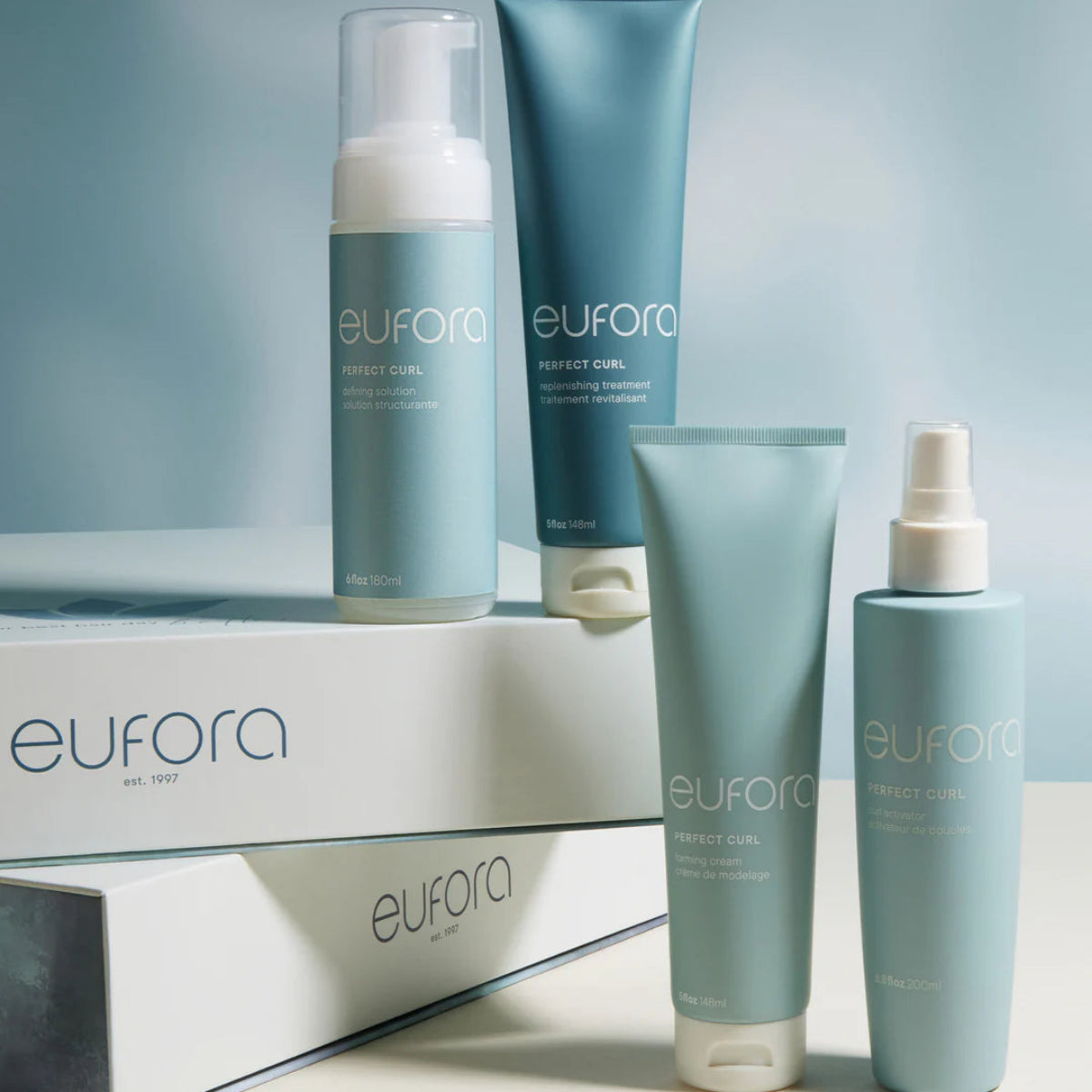 Eufora hair care products on a light gray background