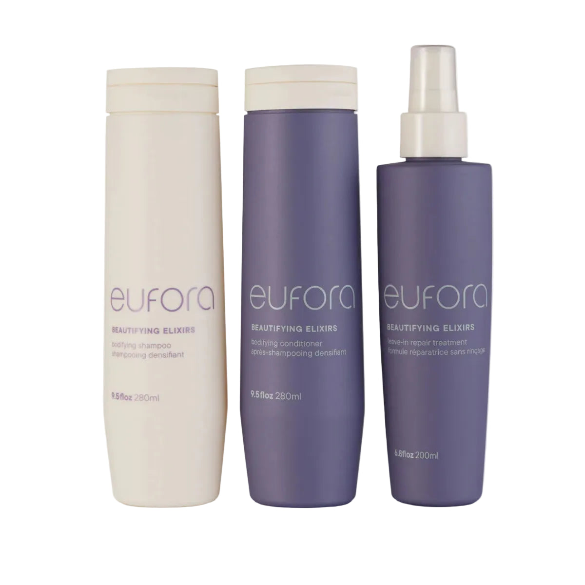 Three Eufora Beauty Tending bottles from the Beautifying Elixir line, including a creamy shampoo bottle, a lavender conditioner bottle, and a matching lavender spray bottle, arranged on a light gray background.