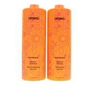 Two bottles of amika normcore shampoo and conditioner on a white background