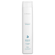 A tall white bottle of L'ANZA Healing Strength White Tea Shampoo 10.1  with a white cap, shown against a plain white background.