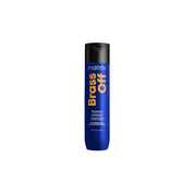 A single bottle of Matrix Brass Off hair product on a plain white background.
