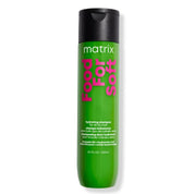 A 10 fl oz bottle of Matrix Food For Soft Hydrating Shampoo for dry hair, featuring a bright green body with pink and white text and a black cap, set against a plain white background.
