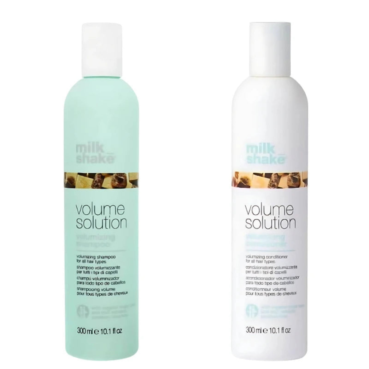 Two Milk Shake Volume Solution hair care bottles on a white background, featuring a mint green shampoo bottle and a white conditioner bottle.