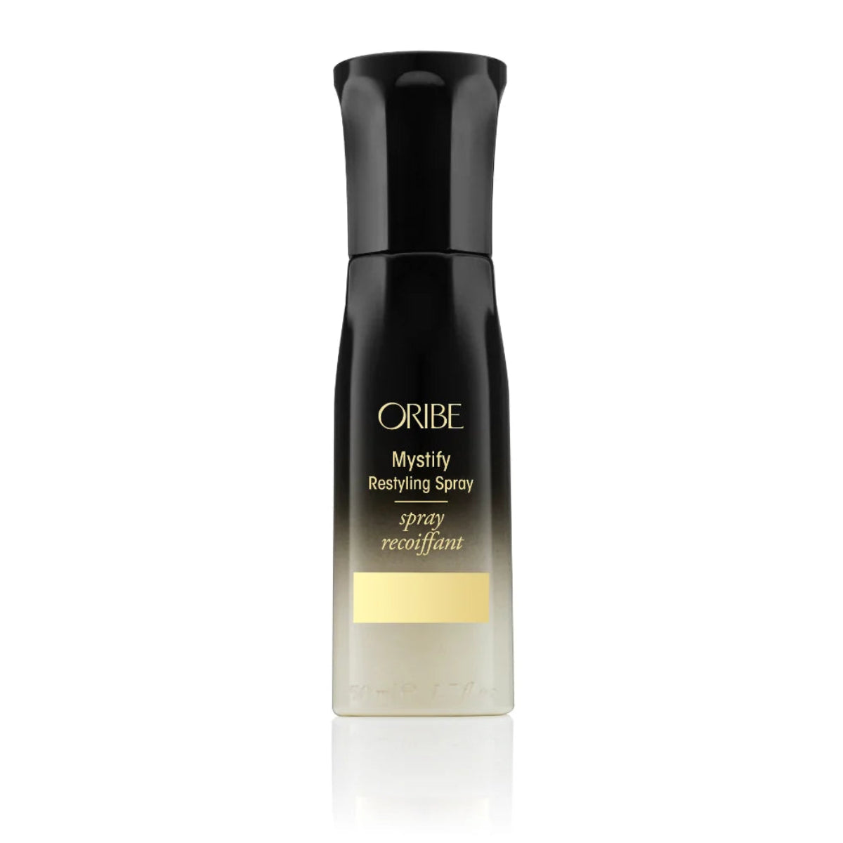 ORIBE Mystify Recyling Spray bottle, featuring a black cap and upper body with gold lettering, and a clear lower section showing the liquid inside, set against a plain white background with a subtle reflection.