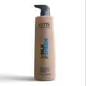 A bottle of KMS California Silk Sheen Hair Conditioner on a white background with a soft shadow.