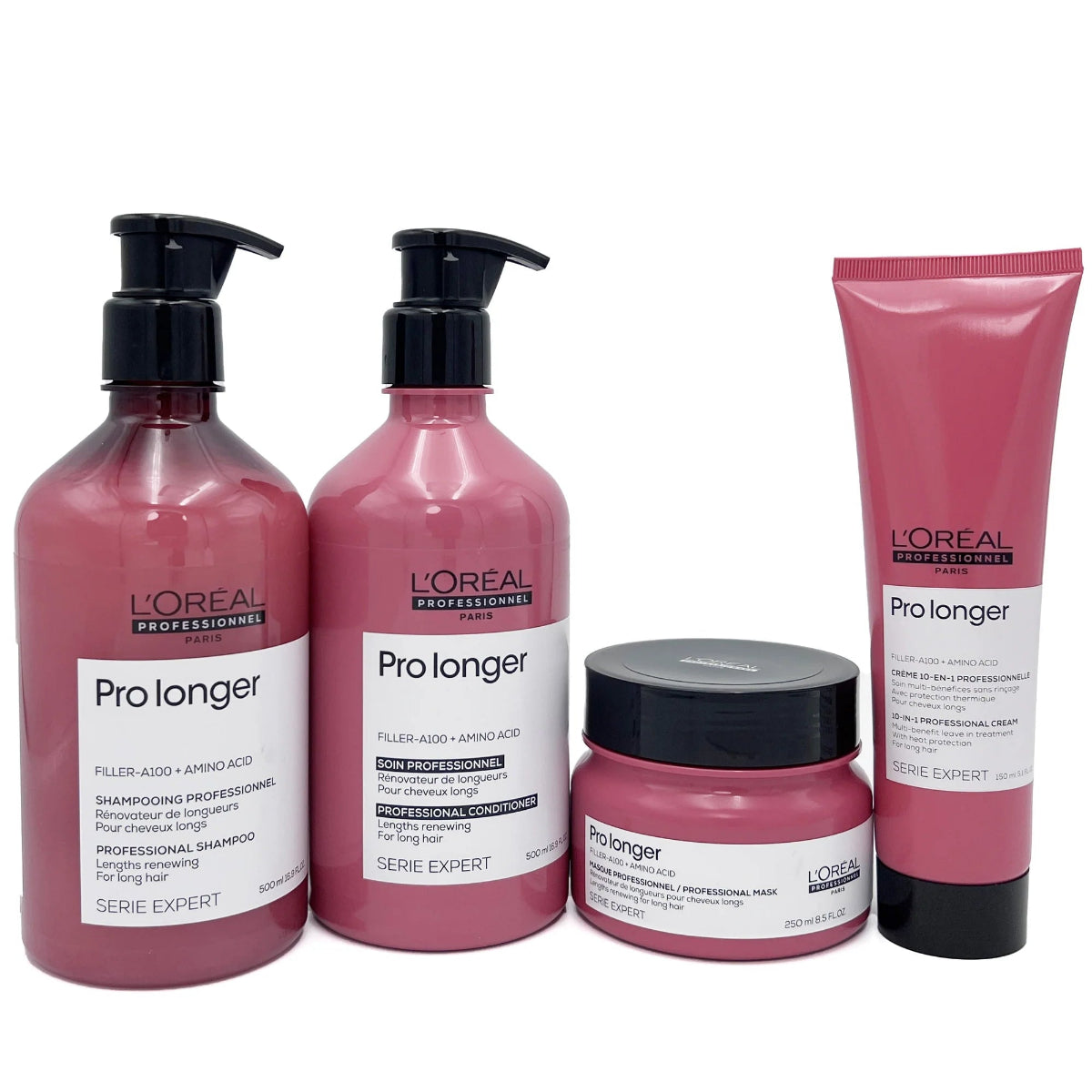 L'Oréal Professionnel Pro longer hair care set featuring a large pump bottle of shampoo, a larger pump bottle of conditioner, a small jar of treatment cream, and a squeeze tube of serum, all in a pink color with black pumps and caps.