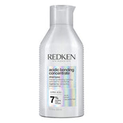 Redken acidic bonding concentrate shampoo bottle on a white background