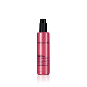 Pink bottle of Pureology hair product on a white background