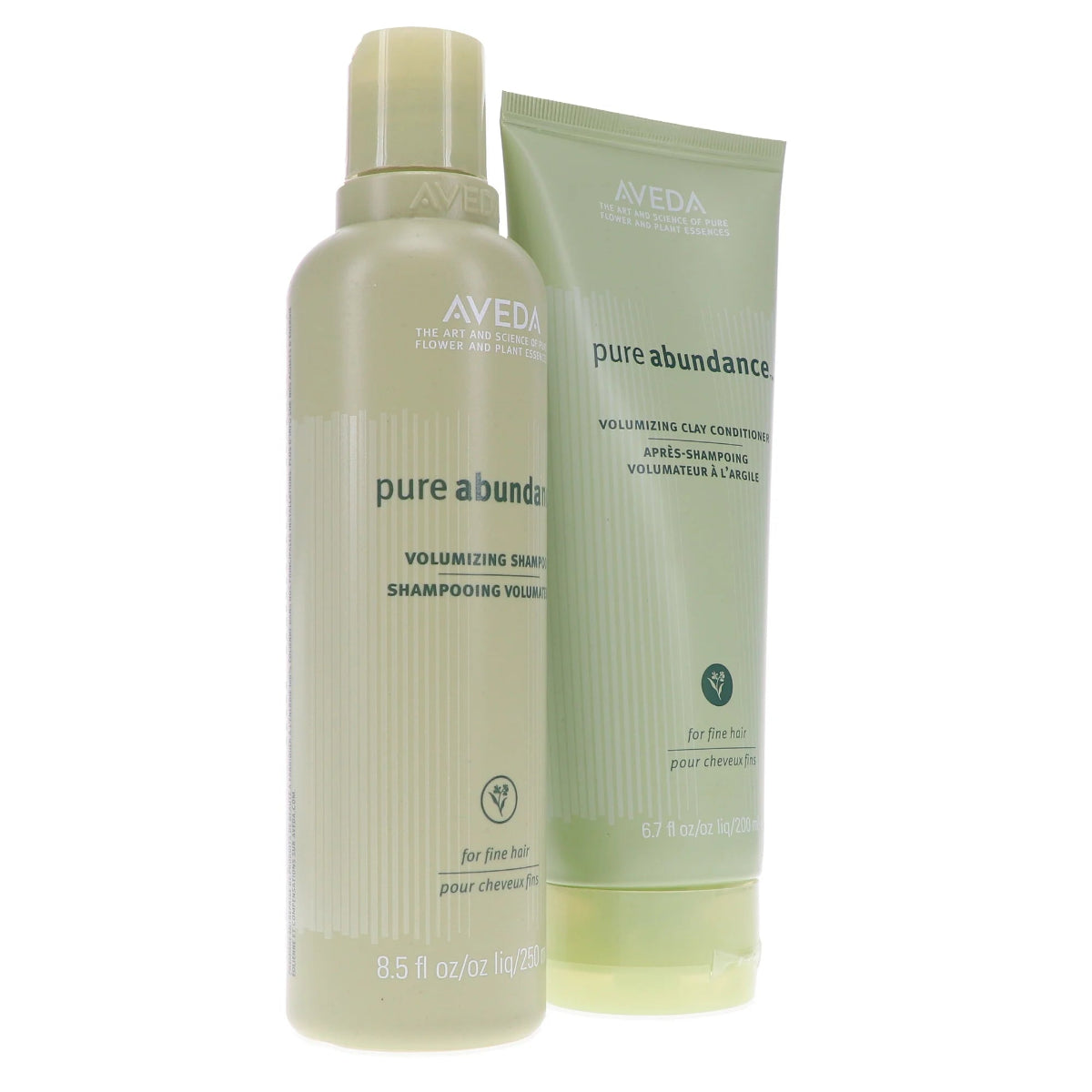 A bottle and tube of Aveda Pure Abundance Volumizing Shampoo and After-Shampoo Care set on a plain white background.