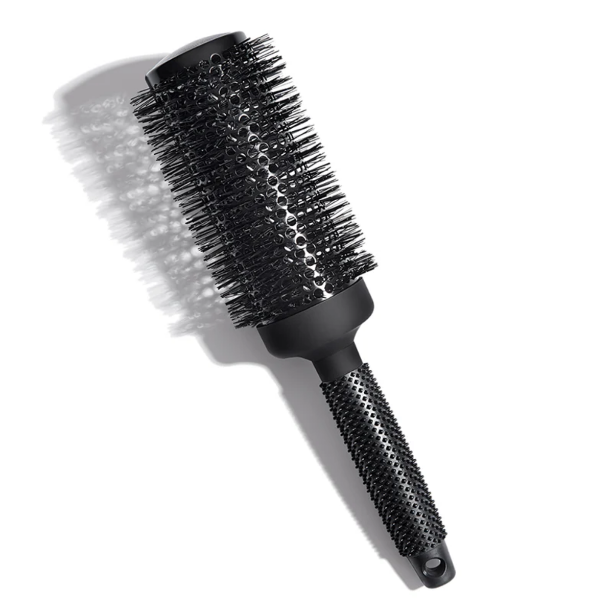 Black round hairbrush on a white background