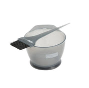 A translucent gray hair developer bowl with a matching applicator brush resting across the rim, shown on a clean white background. The brand name 'surora color' is visible on both the brush handle and the bowl.