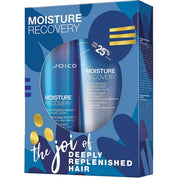 Joico Moisture Recovery hair care set in a blue box, containing moisturizing shampoo and conditioner with blue bottles visible through a circular cutout.