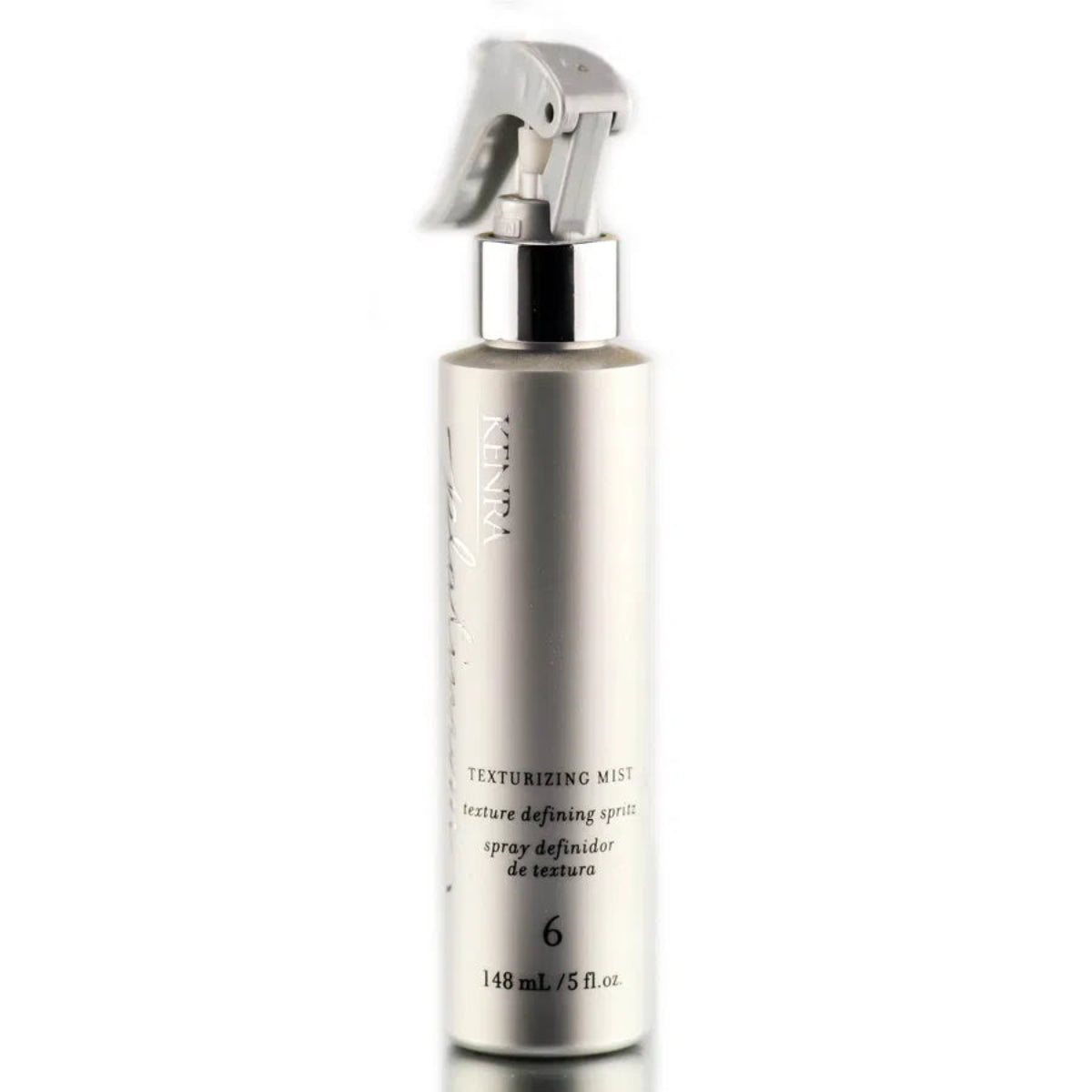 Texturizing mist spray bottle on a white background