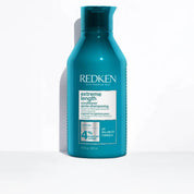 A 300 ml bottle of Redken Extreme Length Conditioner in a vibrant teal blue color, standing upright on a white surface with a soft shadow to the left.