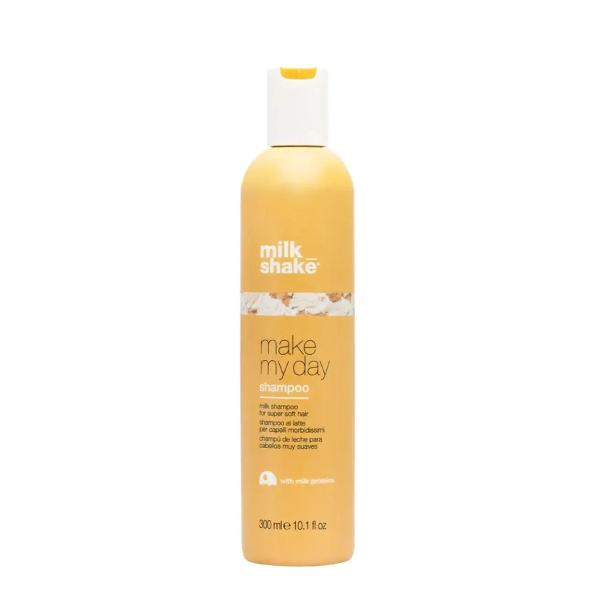 Yellow shampoo bottle with 'milk shake' branding on a white background