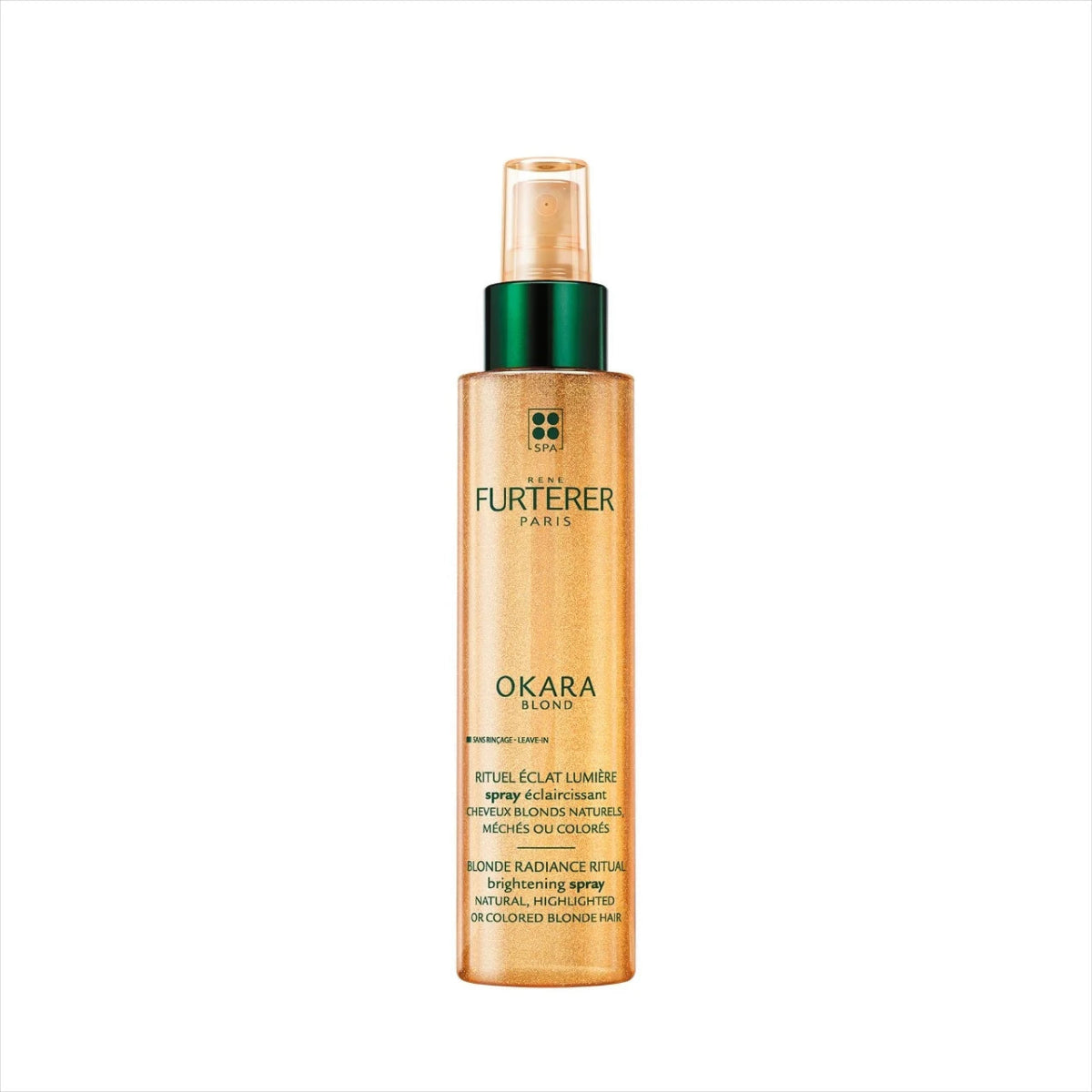 A bottle of Furtèrer Paris Okara Shine Brightening Spray on a solid white background. The bottle is a translucent golden-ochre color with a dark green cap and a clear spray nozzle.