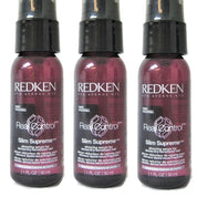 Three bottles of Redken Real Control Slim Supreme serum on a white background