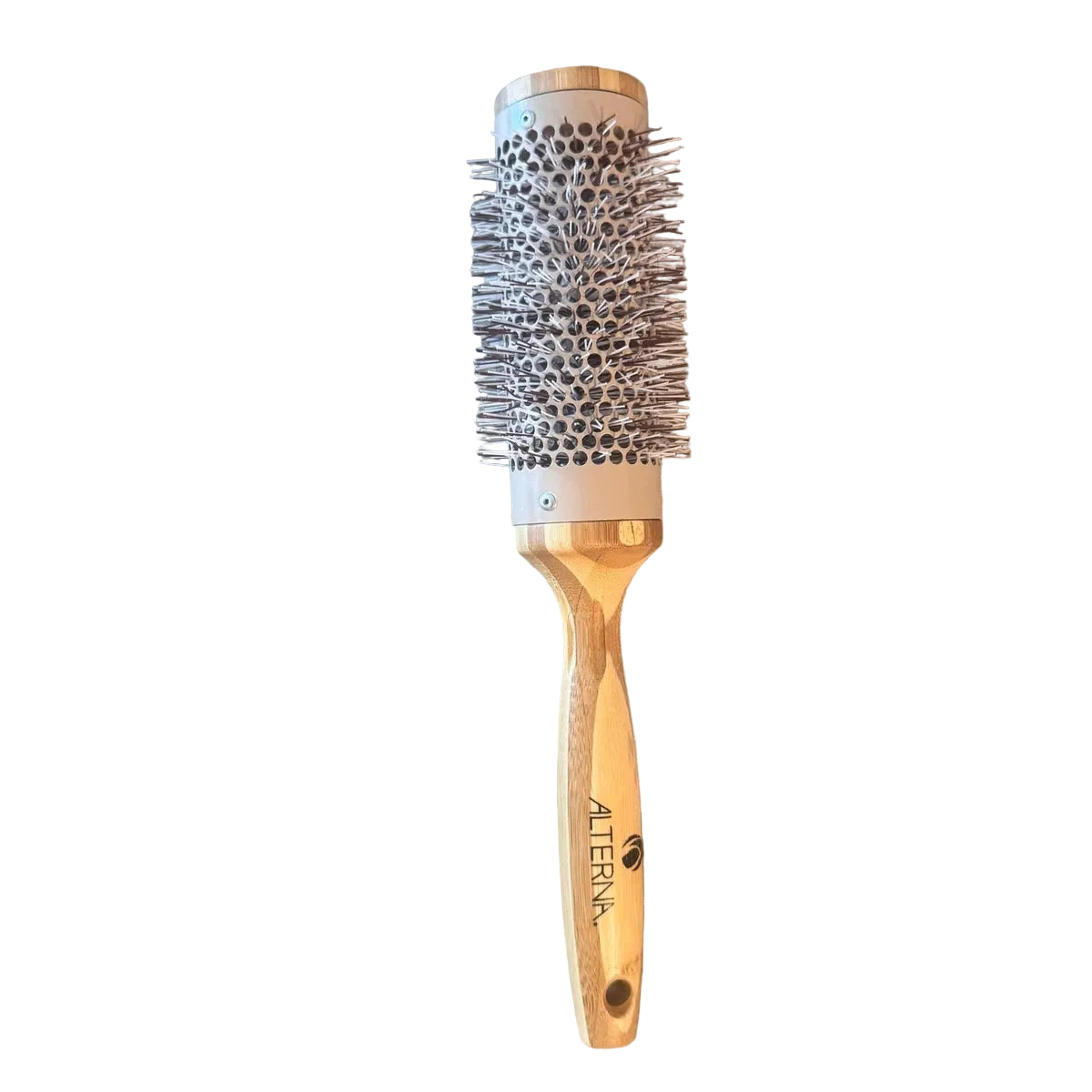 A round hot air brush with a light wood handle and a beige barrel, featuring silver bristles and gold metal accents, resting on a light wood plank over a darker wood floor. The brand name 'ALTERNA' is printed on the handle.