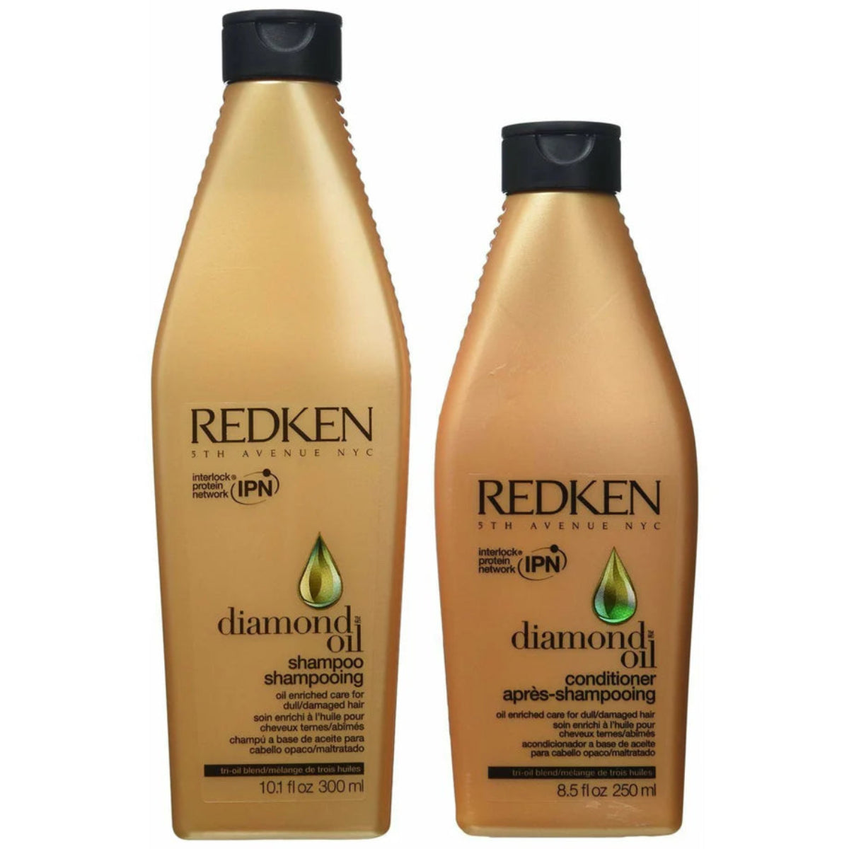 Redken Diamond Oil shampoo and conditioner bottles on a white background