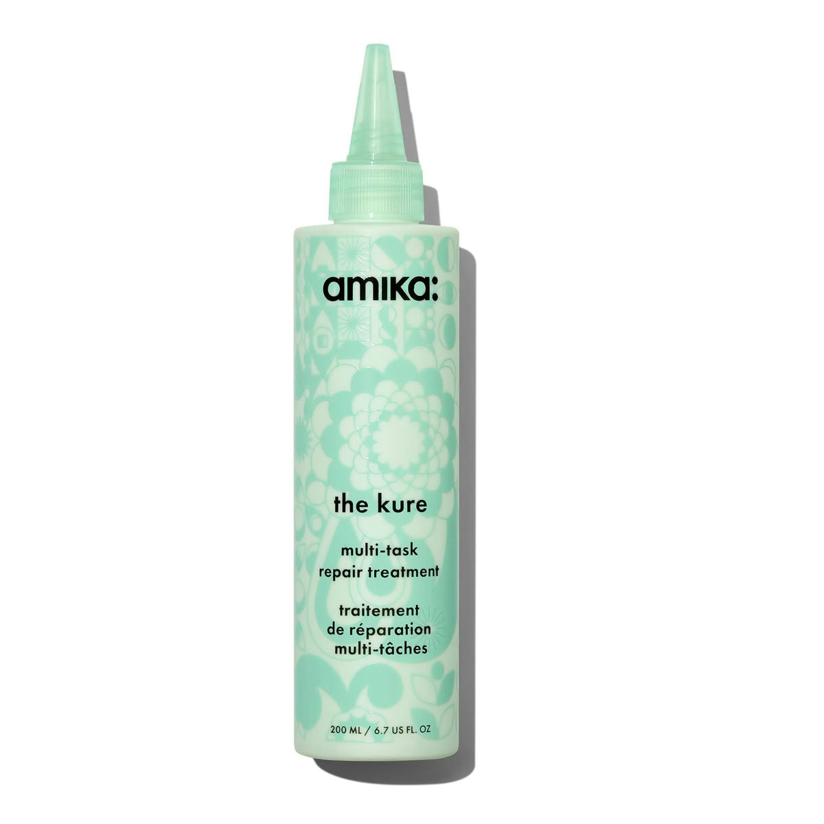 Amika 'the cure' multi-task repair treatment bottle on a white background
