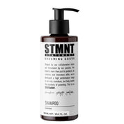 Bottle of STMNT Grooming Goods Shampoo on a white background