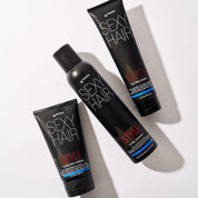 Three bottles of Sexy Hair products on a white background